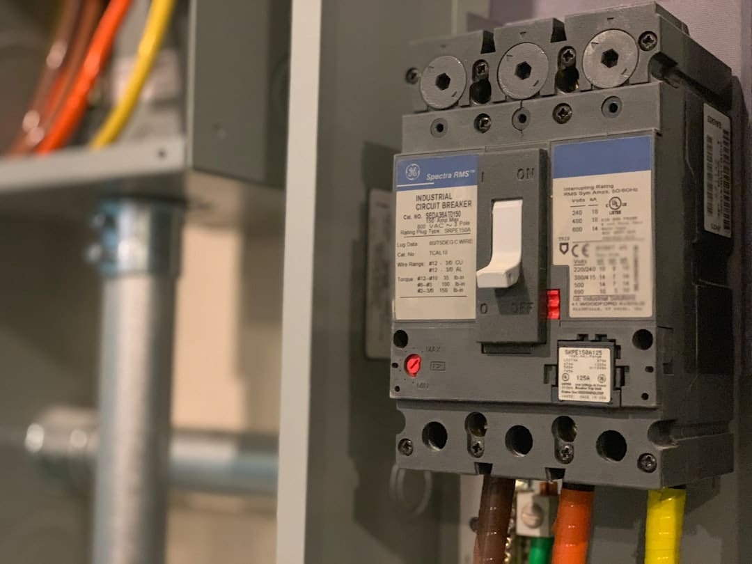 Industrial circuit breaker with multiple connections, showcasing electrical components relevant for commercial electrical systems, emphasizing safety and compliance for businesses.